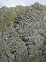 Falaise de pillow-lavas, vue rapprochée. Pan de croûte océanique relevé à la verticale. <A HREF='https://phototheque.enseigne.ac-lyon.fr/photossql/photos.php?RollID=images&FrameID=chenaillet12'>Détail</A> [27246 views]