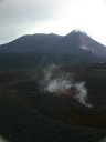 L'Etna est l'un des volcans les plus actifs au monde. Cette vue montre en arrière plan le cratère central (composé des cratères Bocca Nuova (1968) et Voragine(1945)) à gauche et le cratère sud-est (1971) avec ses abondantes fumerolles à droite. Au premier plan, on voit un petit cratère secondaire situé vers 3000 m d'altitude sur le flan sud du volcan.
<BR>
<A HREF='https://phototheque.enseigne.ac-lyon.fr/photossql/GoogleEarth/etna3.kmz'>
<IMG SRC='googleearth.gif' BORDER=0>
</A> [9803 views]