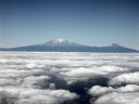 Le Kilimanjaro, un immense cône d'environ 90 km de diamètre, est divisé en 2 sommets distincts : le Kibo ("blanc" en langue chagga), le plus jeune avec ses 5895 m et le Mawenzi ("noir"), 5 148 m.
<BR>
<A HREF='https://phototheque.enseigne.ac-lyon.fr/photossql/GoogleEarth/kilimandjaro.kmz'>
<IMG SRC='googleearth.gif' BORDER=0>
</A> [28764 views]